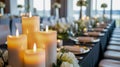 Close view of candles and table setting in a bright indoor environment Royalty Free Stock Photo