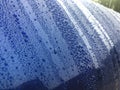 Close view on car paint polished with water drops beading Royalty Free Stock Photo