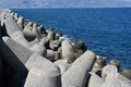 Close view on concrete tetrapod breakwater stones piled up in wave breaker to protect Port of Heraklion.
