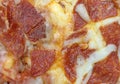 Close view of a cooked pepperoni pizza Royalty Free Stock Photo
