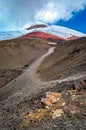 Close view of the Cotopaxi volcano, it`s slopes, rocks and safe house, on an cloudy yet sunny day, Cotopaxi National Park, Ecuador Royalty Free Stock Photo