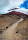 Close view of the Cotopaxi volcano, it`s slopes, rocks and safe house, on an cloudy yet sunny day, Cotopaxi National Park, Ecuador Royalty Free Stock Photo