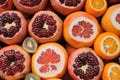 Close view of cutted garnet end orange fruites on market
