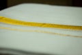 Close view of the dhoti with gold threaded border. Dhoti is a traditional south indian dress wore by men during festivals,