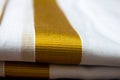 Close view of the dhoti with gold threaded border. Dhoti is a traditional south indian dress wore by men during festivals,