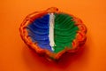Close view of Earthen lamp painted in indian tri color Royalty Free Stock Photo