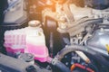 Close view of an engine water cooling system of a serviced car.