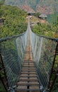 CLOSE VIEW OF ENTRANCE OF SUSPENSION BRIDGE OVER ORIBI GORGE Royalty Free Stock Photo