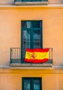 Close view of Facade with windows and spanish flags