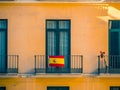 Close view of Facade with windows and spanish flags