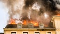 Close view of flames in an upper story window