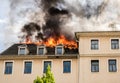 Close view of flames in an upper story window