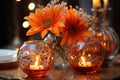 close view of flowers and glass balls with candles on a festive background of illumination, bokeh lights, Christmas Royalty Free Stock Photo