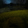 Close view of a grave under moonlight at night in the countryside