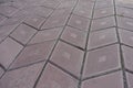 Close view of grayish pink diamond-shaped concrete pavement with geometric pattern Royalty Free Stock Photo