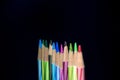 A close view of Group of Colored Pencil in black background for drawing art writing purpose