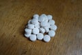 Close view of handful of white pills
