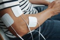 man sitting with electrode pads on his arm Royalty Free Stock Photo
