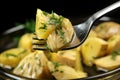 close view of marinated artichoke hearts on a spoon