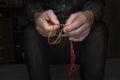 Close view of men's hands with rosary Royalty Free Stock Photo