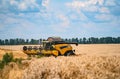 close view of modern combine harvester in action. Agricultural concept Royalty Free Stock Photo