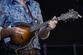 Close-up of a musician playing a mandolin