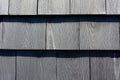 Close view of newer grayed cedar shingles in rows Royalty Free Stock Photo