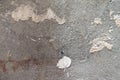 Close view of an old concrete floor with glue buildup and dirt