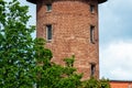 Close view of a old red brick water tower against blue sky Royalty Free Stock Photo