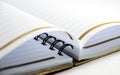 A Close View Of An Open Diary Or Notepad With Rings Isolated On A White Background