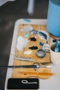 Close view of painter's palette with tools on the table Royalty Free Stock Photo