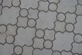 Close view of pavement of curved grey interlocking concrete tiles Royalty Free Stock Photo