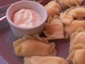 Close view on a plate with traditional Ukrainian desert - vareniky stuffed with cherry berry