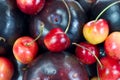 Close view plums and cherries