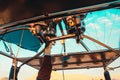 Close view of the propane burner torch on an air balloon. Pilots hand on the lever used for piloting the air balloon