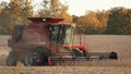 Close View of Red Combine in Soybean Field Royalty Free Stock Photo