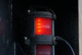 Close view on red port side navigational lights of the container ship.