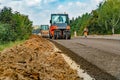 Close view on the road rollers working on the new road construction site. Road paving Royalty Free Stock Photo