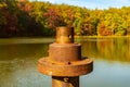 Detail of rusty metal pipe with fall leaves in Coopers Rock in WV