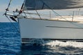 Close view at sailboat bow with hoisted genoa is sailing in the Mediterranean