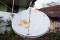 Close view of satellite dish. Telecommunications round antenna. Urban connection receiver. TV connection signal. City radio