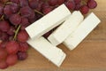 Feta cheese slices with fresh grapes Royalty Free Stock Photo