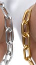 Close View of Silver and Gold Chain Links Held in Hands for Comparison and Display Royalty Free Stock Photo