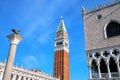 Close view of St Mark`s Campanile, Lion of Venice statue and Palazzo Ducale at Piazzetta San Marco in Venice, Italy Royalty Free Stock Photo