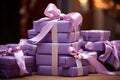 Close view the stack of purple boxes tied with silk ribbon, lying on each other on living. Gift festive selection