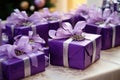 Close view the stack of purple boxes tied with silk ribbon, lying on each other on living. Gift festive selection