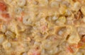 Close view of stirred macaroni and cheese baby food