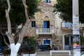 A close view of a stone, old, traditional house and it`s balcony in Calymnos Island