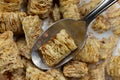 Close view of taking a spoonful of wheat cereal with milk and cinnamon Royalty Free Stock Photo