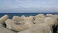 Close view of tetrapod stones on the sea shore to prevent coastal ersosion Royalty Free Stock Photo